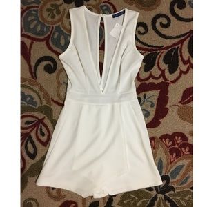 Plunging Neckline Romper w/ Asymmetrical Hem